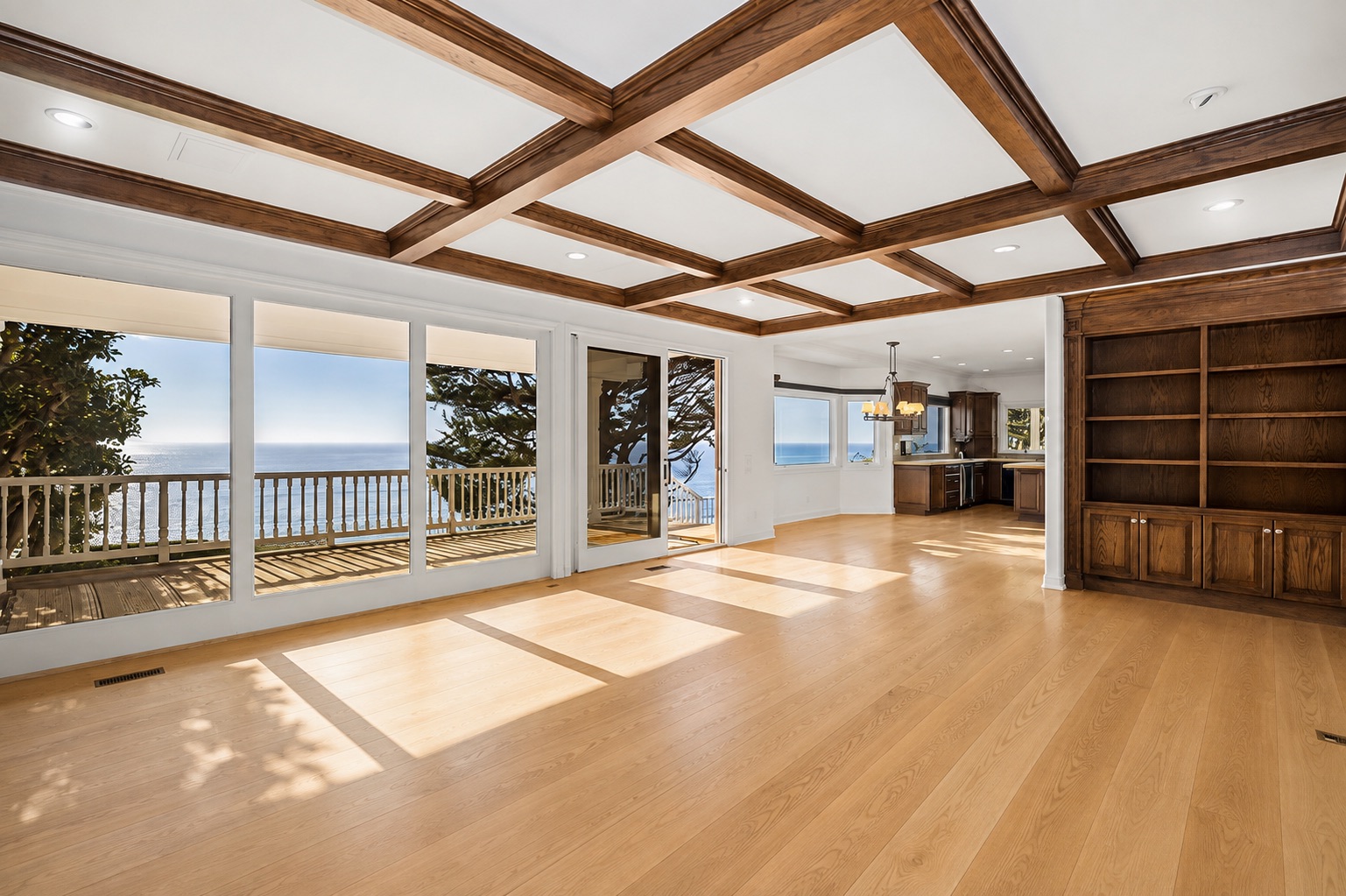 Same living room after new wide-plank flooring was installed